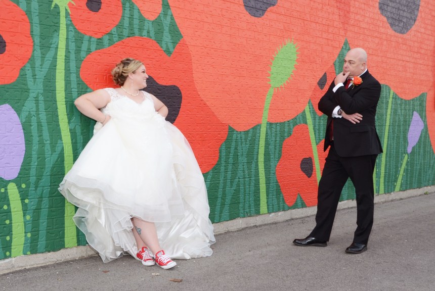 Wedding Photo of the Bride and Groom at the poppy wall in St.Thomas Ontario
