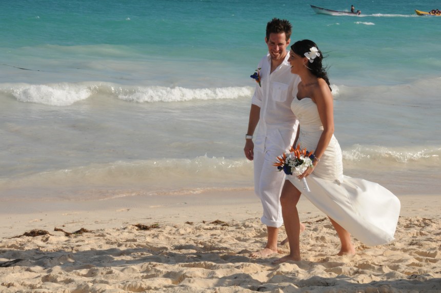 Kissing on the beach by Columbia Photos based in London Ontario