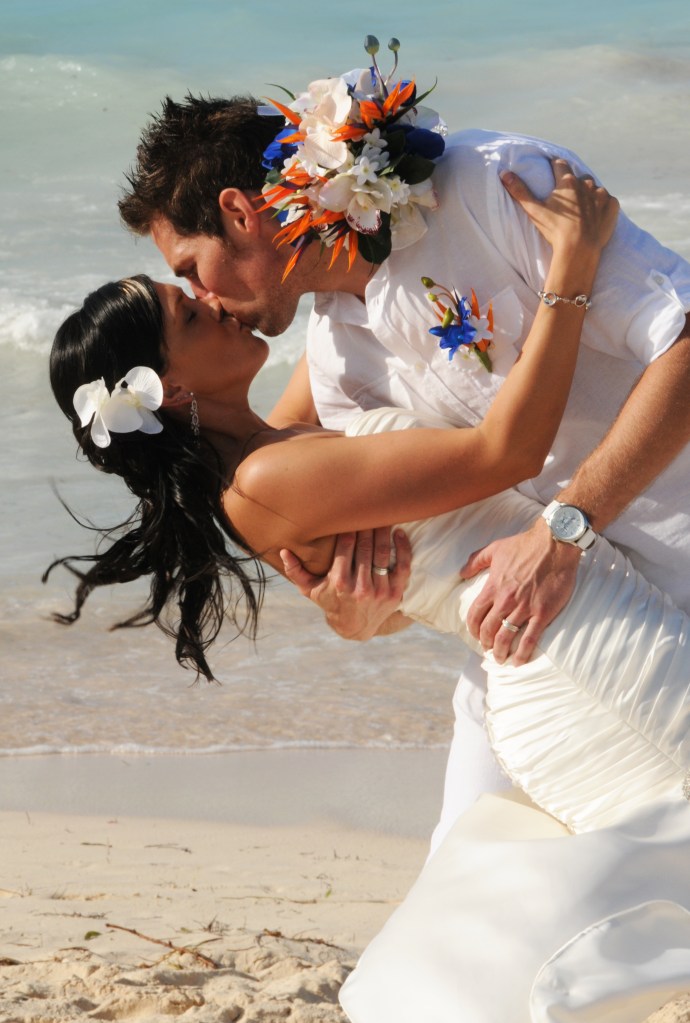 Kissing on the beach by Columbia Photos based in London Ontario